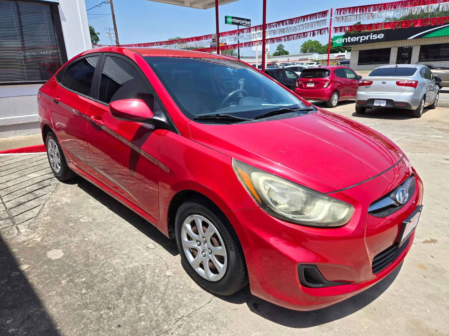 2014 Red Hyundai Accent GLS 4-Door (KMHCT4AE9EU) with an 1.6L L4 DOHC 16V engine, Automatic transmission, located at 503 West Court, Seguin, TX, 78155, (830) 379-3373, 29.568621, -97.969803 - Photo#1